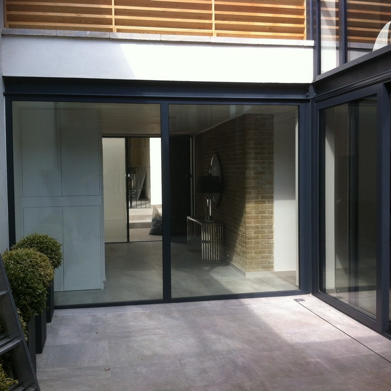 Floor-to-ceiling sliding doors opening to courtyard in Camden Town