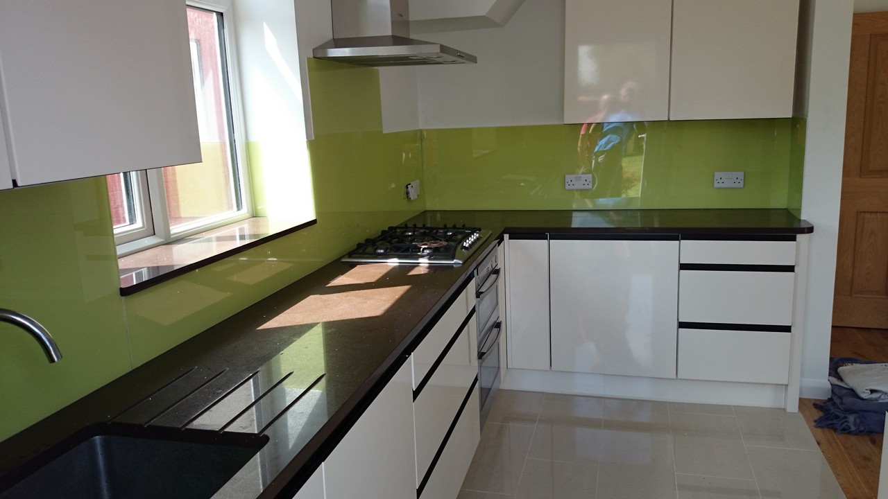 Lime green glass kitchen splashback installed by Camden Town glaziers