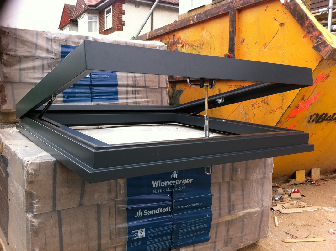 Opening flat roof skylight in anthracite grey installed in Camden Town